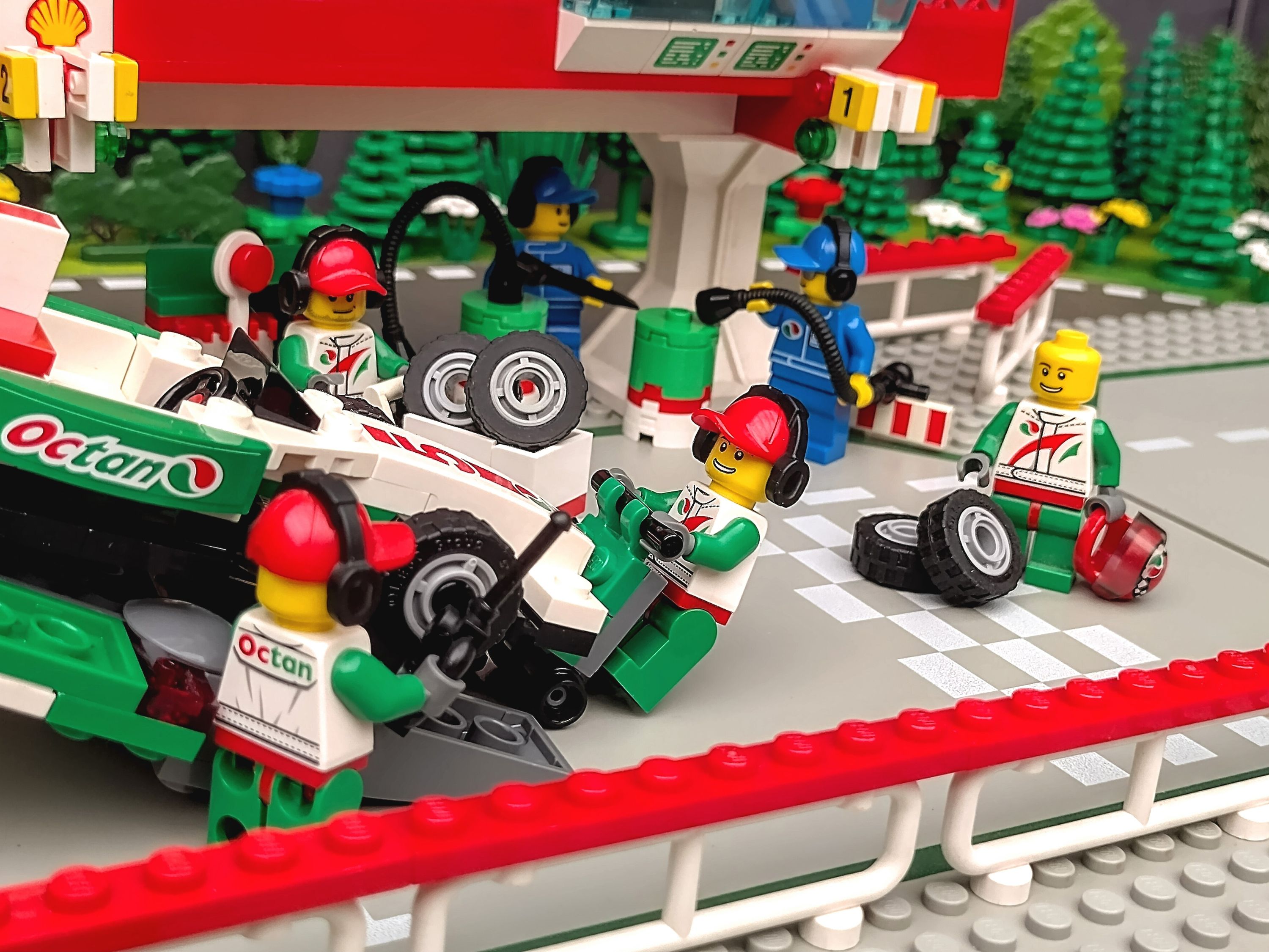 The team crew set up their pit box for the day. — a brick-built scene by @pixalixbrix, from the world Victory Lap Raceway